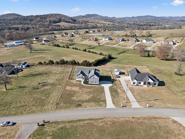 bird's eye view with a mountain view and a rural view