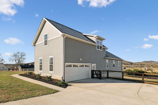 view of side of property with a garage