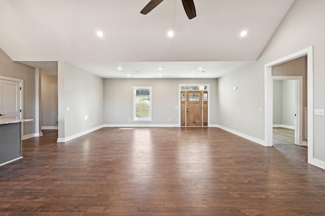 unfurnished living room with high vaulted ceiling, ceiling fan, and dark wood-type flooring