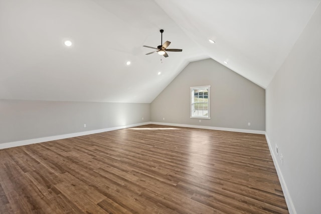 additional living space with vaulted ceiling, ceiling fan, and dark hardwood / wood-style floors