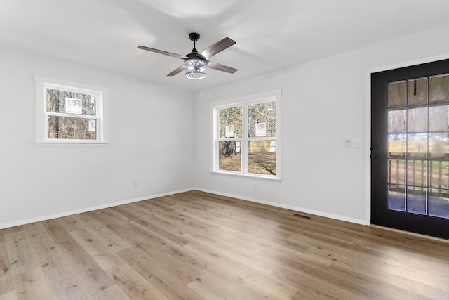 unfurnished room with light hardwood / wood-style flooring and ceiling fan