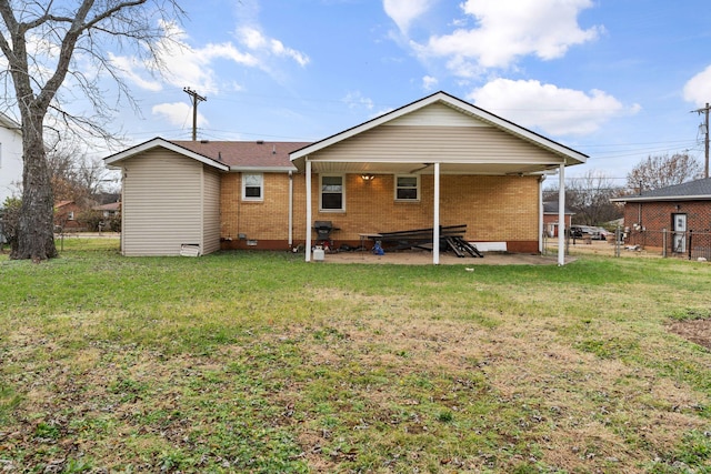 rear view of house with a lawn