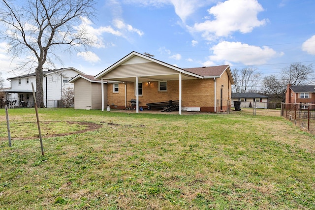 back of house featuring a lawn