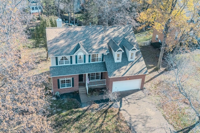 view of front of house with covered porch and a garage