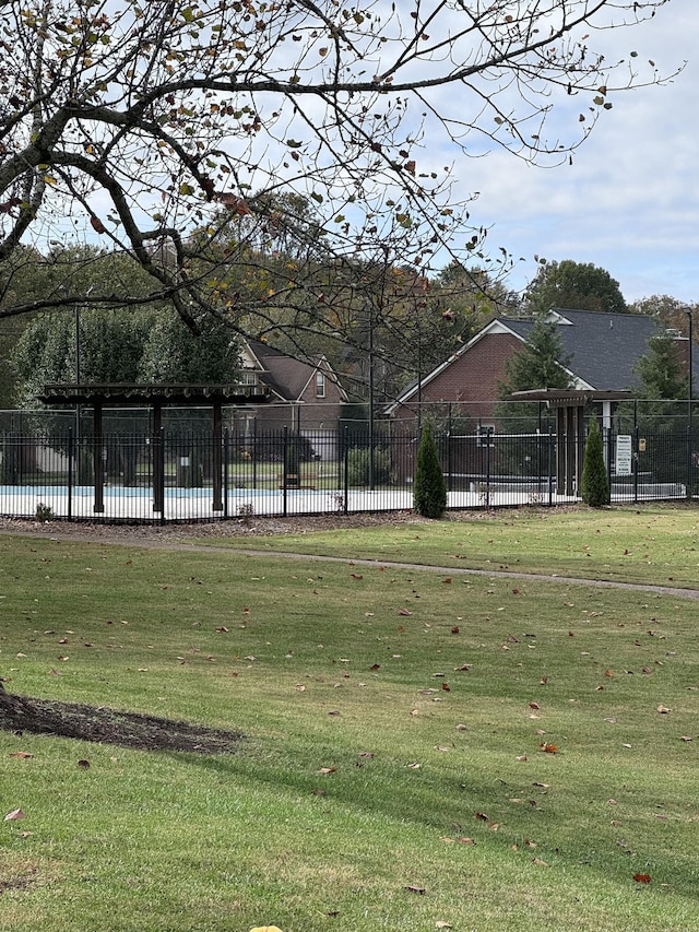 view of community featuring a yard