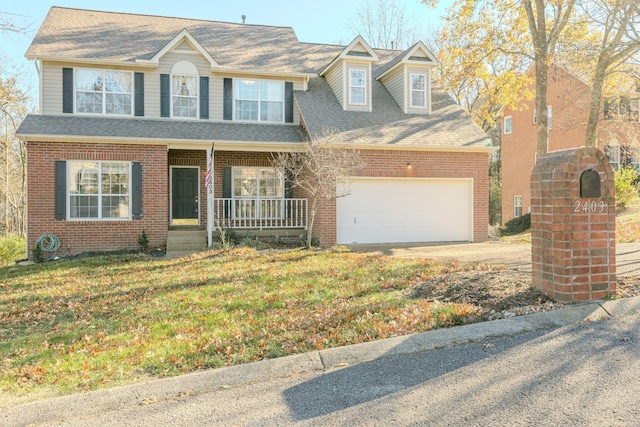 view of front facade featuring a front yard and a porch