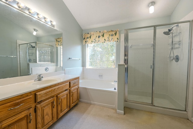 bathroom featuring vanity, lofted ceiling, and independent shower and bath