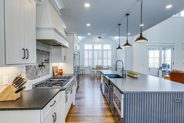 kitchen with plenty of natural light and white cabinetry