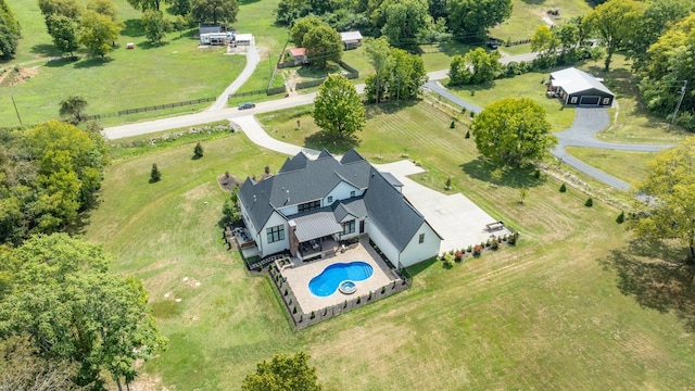 birds eye view of property with a rural view