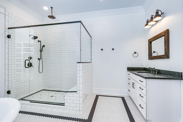 bathroom with tile patterned floors, crown molding, a shower with door, and vanity