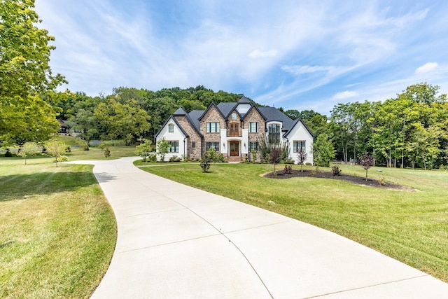 tudor home with a front yard