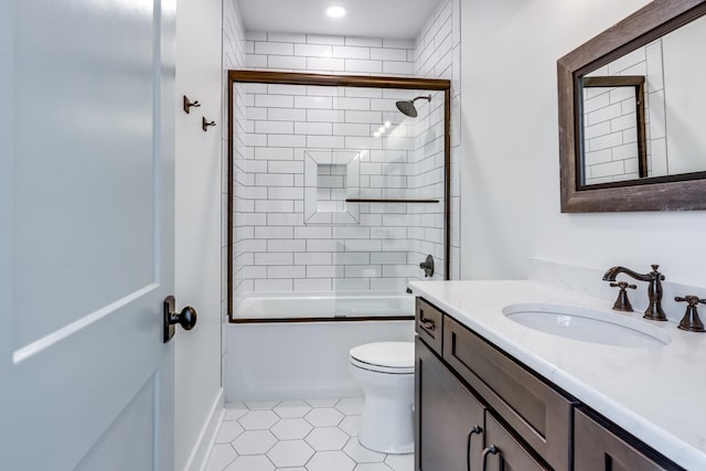 full bathroom with tile patterned floors, vanity, toilet, and combined bath / shower with glass door