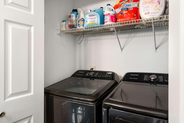 clothes washing area featuring washing machine and clothes dryer