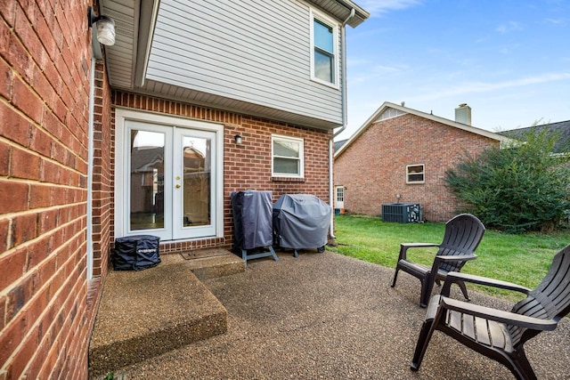 view of patio featuring area for grilling, central air condition unit, and french doors