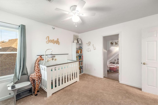 carpeted bedroom featuring a textured ceiling and ceiling fan