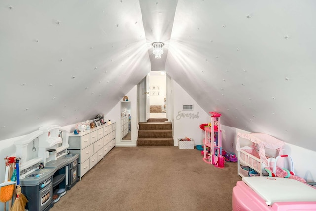 rec room featuring lofted ceiling and carpet