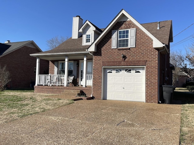 view of front of house featuring a garage and a porch