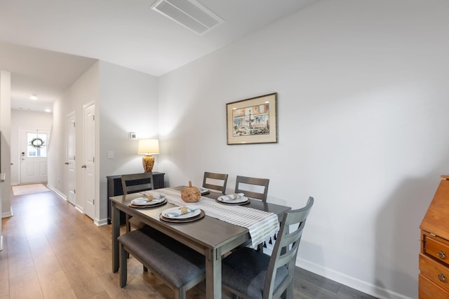 dining area featuring wood-type flooring