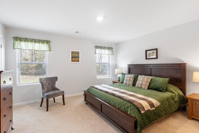 carpeted bedroom with multiple windows