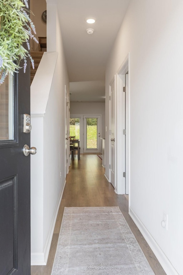 hallway with light wood-type flooring