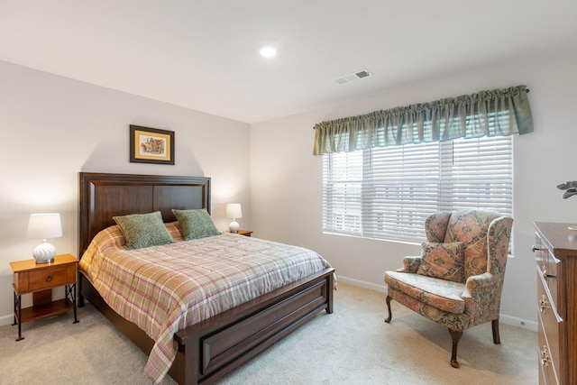 bedroom featuring light colored carpet