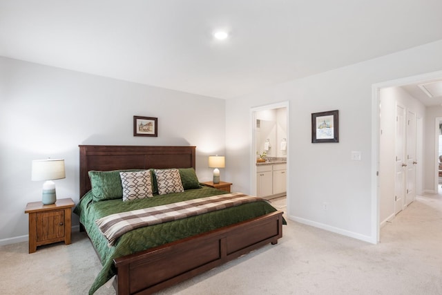 carpeted bedroom with ensuite bathroom