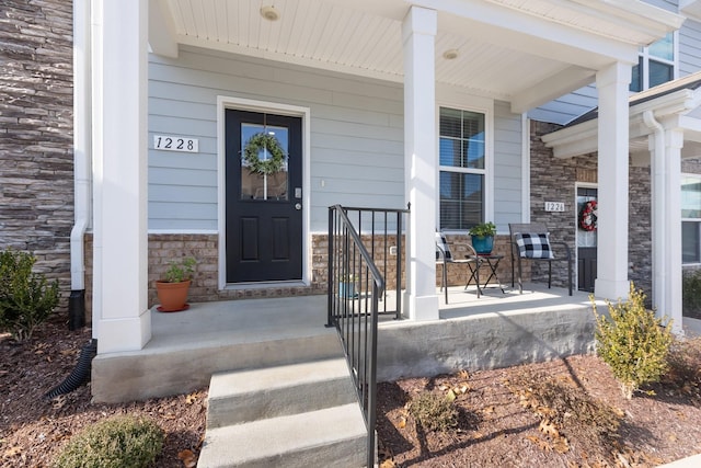 doorway to property with covered porch