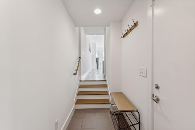 stairway featuring tile patterned floors