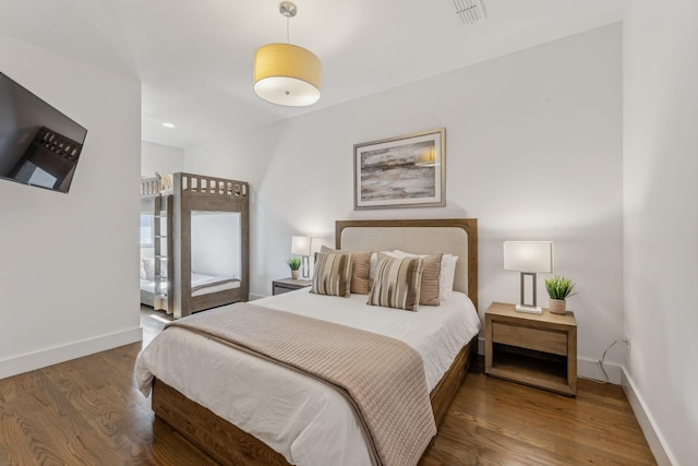 bedroom featuring dark wood-type flooring