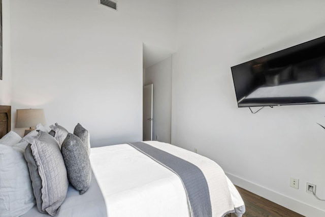 bedroom featuring dark hardwood / wood-style floors