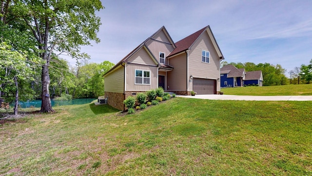 view of front of house with cooling unit, a front yard, and a garage