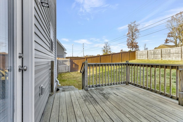 wooden terrace with a yard