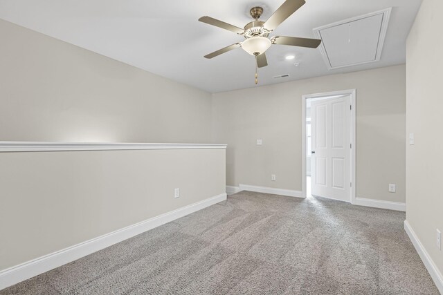 carpeted empty room featuring ceiling fan