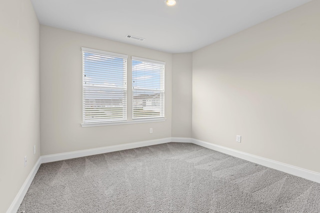 unfurnished room featuring carpet flooring