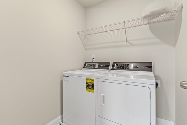 1249 June Wilde Rdg, Spring Hill, TN 37174 - laundry area featuring separate washer and dryer and baseboards