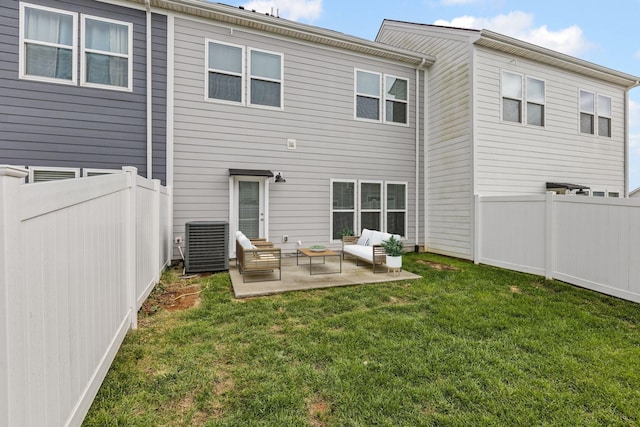 rear view of property with an outdoor living space, central AC unit, a patio area, and a lawn