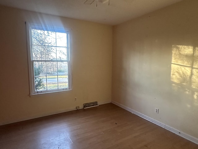 spare room featuring hardwood / wood-style flooring