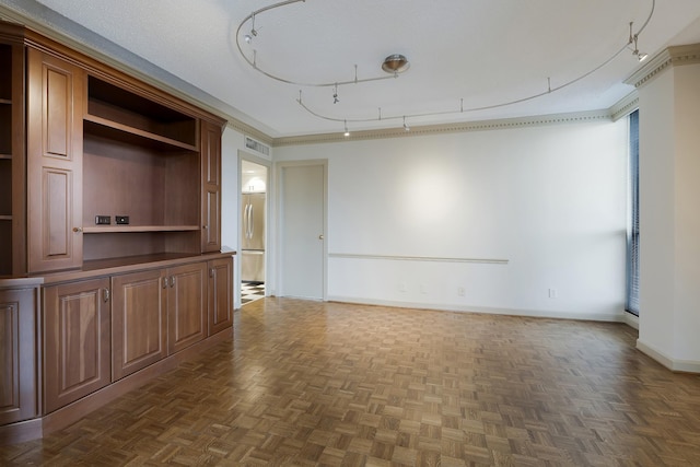 unfurnished living room with dark parquet flooring and a textured ceiling