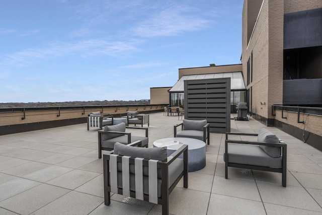 view of patio / terrace with an outdoor living space and a grill