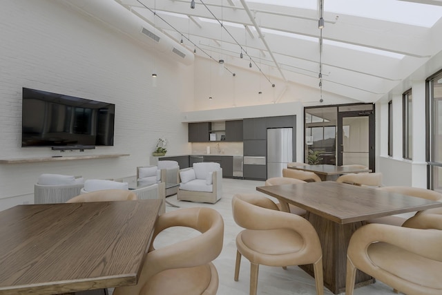 interior space featuring a high ceiling and sink