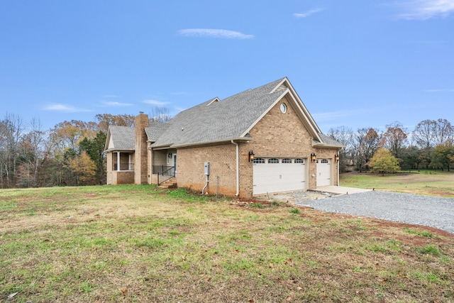 view of home's exterior with a lawn and a garage