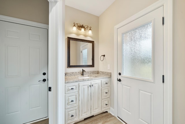 bathroom featuring hardwood / wood-style floors and vanity