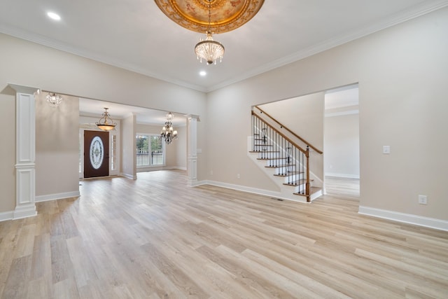 unfurnished living room with a chandelier, ornamental molding, and light hardwood / wood-style flooring