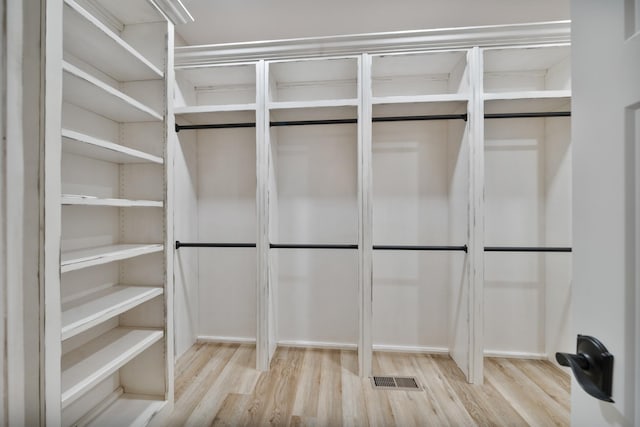 spacious closet featuring light wood-type flooring