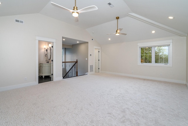 empty room featuring ceiling fan, carpet, and lofted ceiling