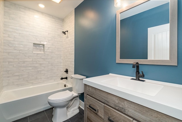 full bathroom featuring tile patterned floors, tiled shower / bath combo, toilet, and vanity