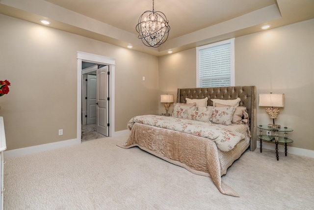 carpeted bedroom with an inviting chandelier