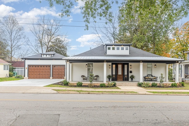 view of front of house with a garage and covered porch