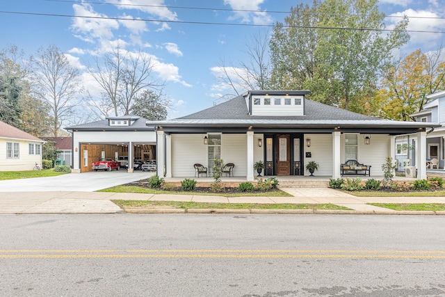 view of front of house featuring covered porch and a garage