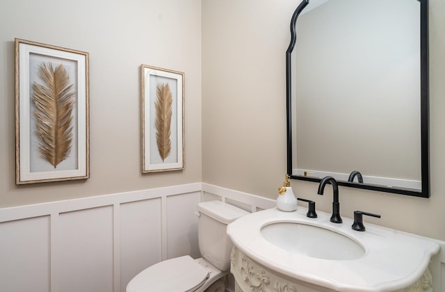 bathroom with toilet and sink